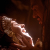  evil xena cackling while her lover holds her face